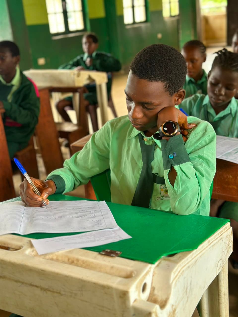 Student writing during a lesson